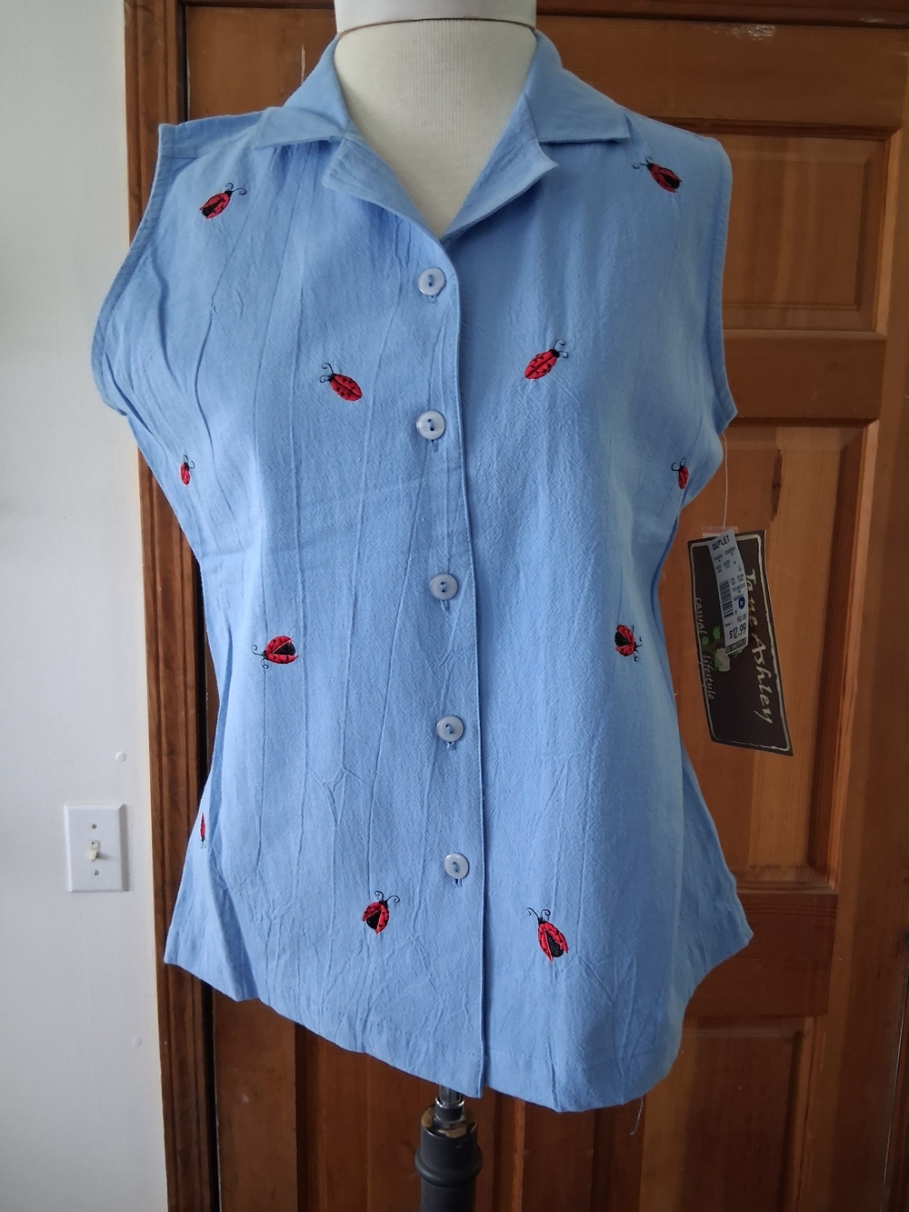Jane Ashley Light Blue Sleeveless Button-Up Top with Red Ladybug Embroidery